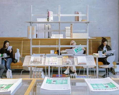 a bookstore inside cobe copenhagen: a material library of architecture, cities, and ideas