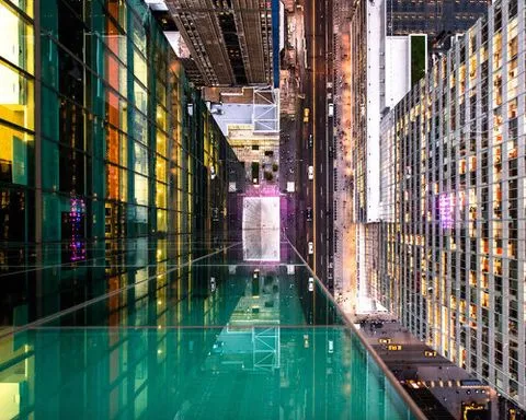 photo series distorts manhattan’s cityscape through fractured glass reflections