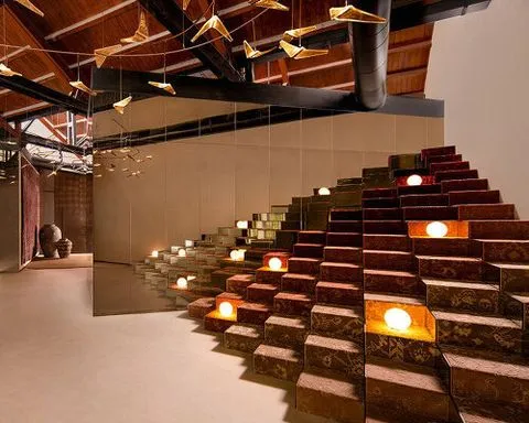 former textile warehouse transforms into fractal-inspired jaipur rugs showroom in mumbai