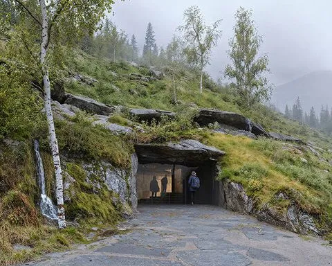 PAX proposes a cavernous museum embedded into norway’s fjord landscape