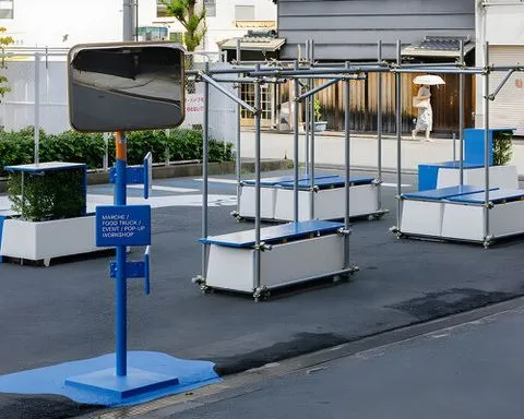 scaffolding pipes turn into street furniture activating a future development site in osaka
