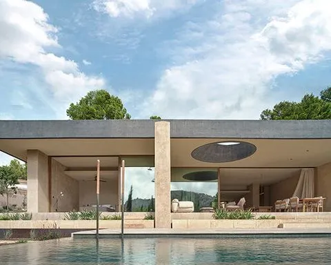 circular roof opening brings sunlight into casa óculo by OHLAB in palma
