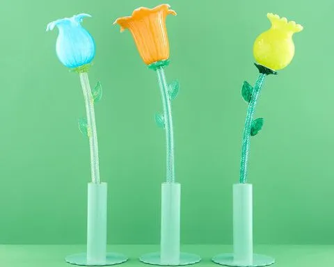 six murano glass flowers turn into portable table lamps that glow at a touch